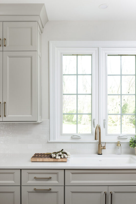 Painted kitchen cabinets by a window