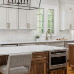 Painted kitchen cabinets with stained double islands