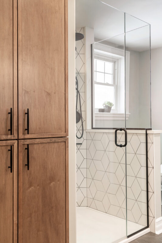 Bathroom with stained vanity and doors to cover laundry space