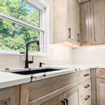 Stained kitchen cabinets with painted island