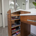 Bathroom storage cabinet with a pullout organization accessory