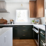 Stained and painted open floor plan kitchen with island