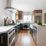 Stained and painted open floor plan kitchen with island