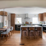 Stained and painted open floor plan kitchen with island