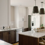 Painted and stained kitchen cabinets, including island.