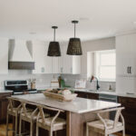 Painted and stained kitchen cabinets, including island.