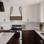 Painted and stained kitchen cabinets, including island.