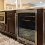 Stained home bar with wine cooler appliance