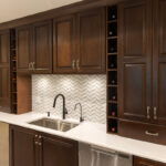 Stained home bar with sink and appliances