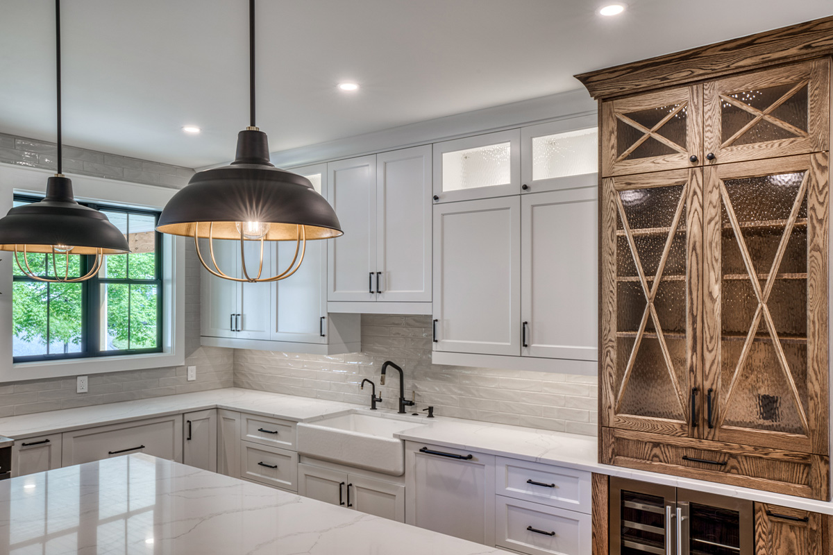 Stained and painted kitchen cabinets with glass and mullion glass doors