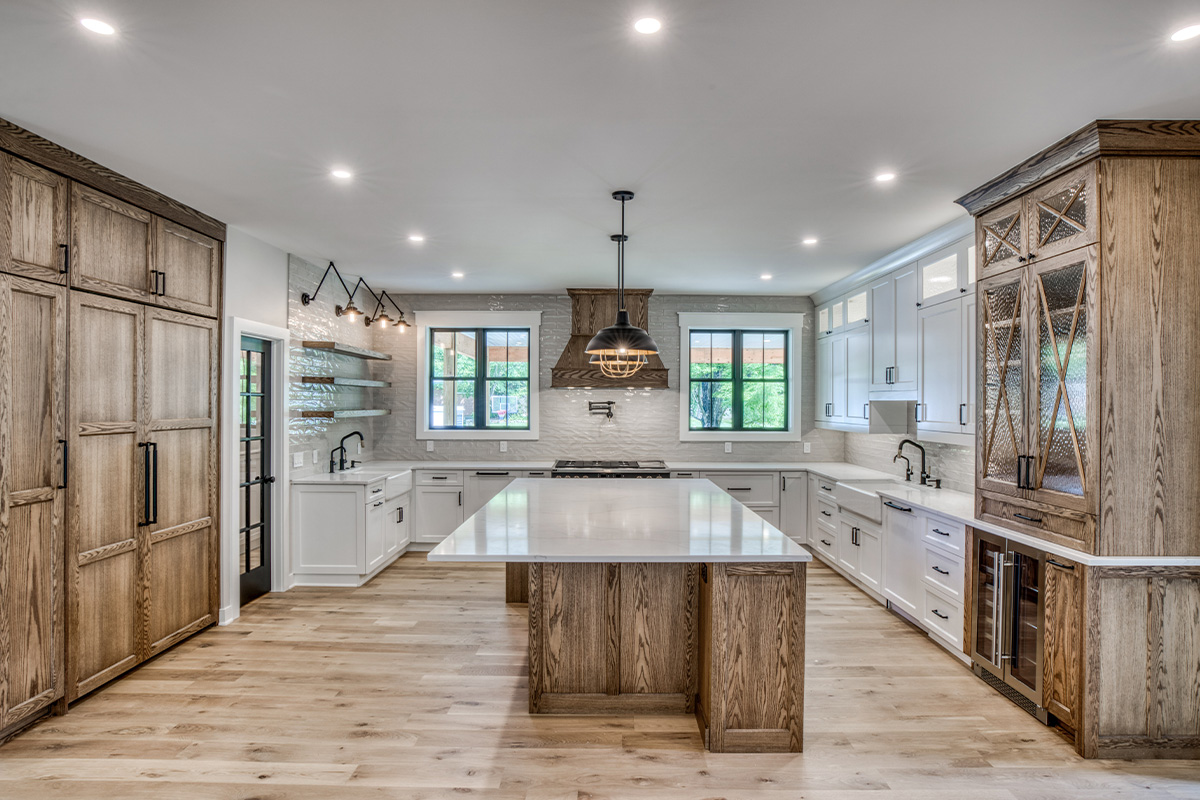 Stained and painted kitchen cabinets with island