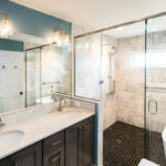 Bathroom with vanity, mirror and glass shower