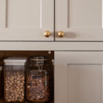 Painted wall cabinet with food and appliance storage