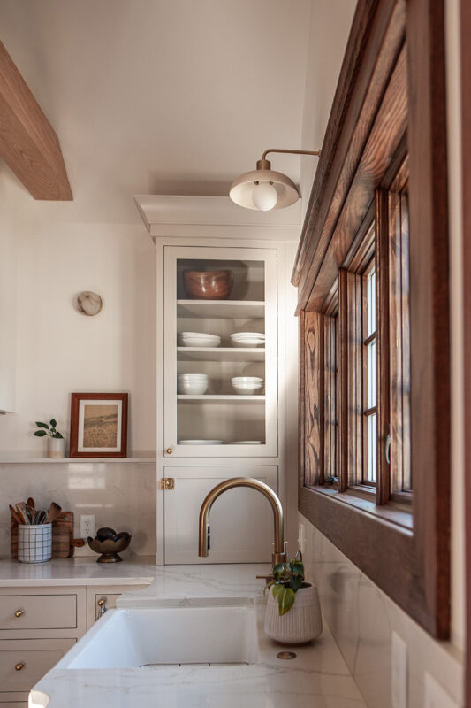 Small painted kitchen next to a window