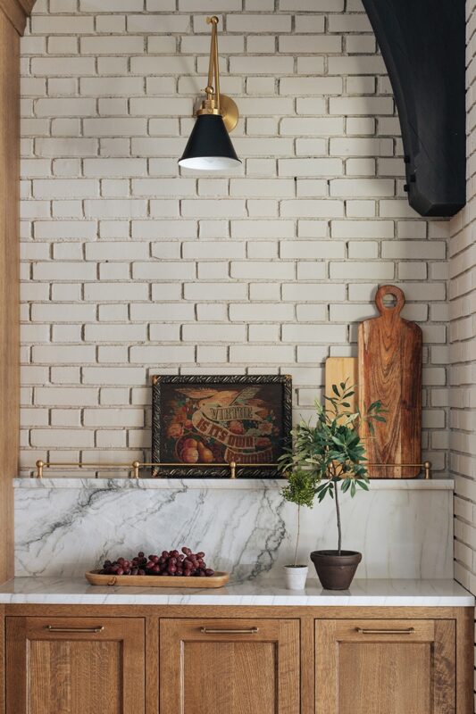 highlighting subway tile backsplash with plants and other kitchen decor