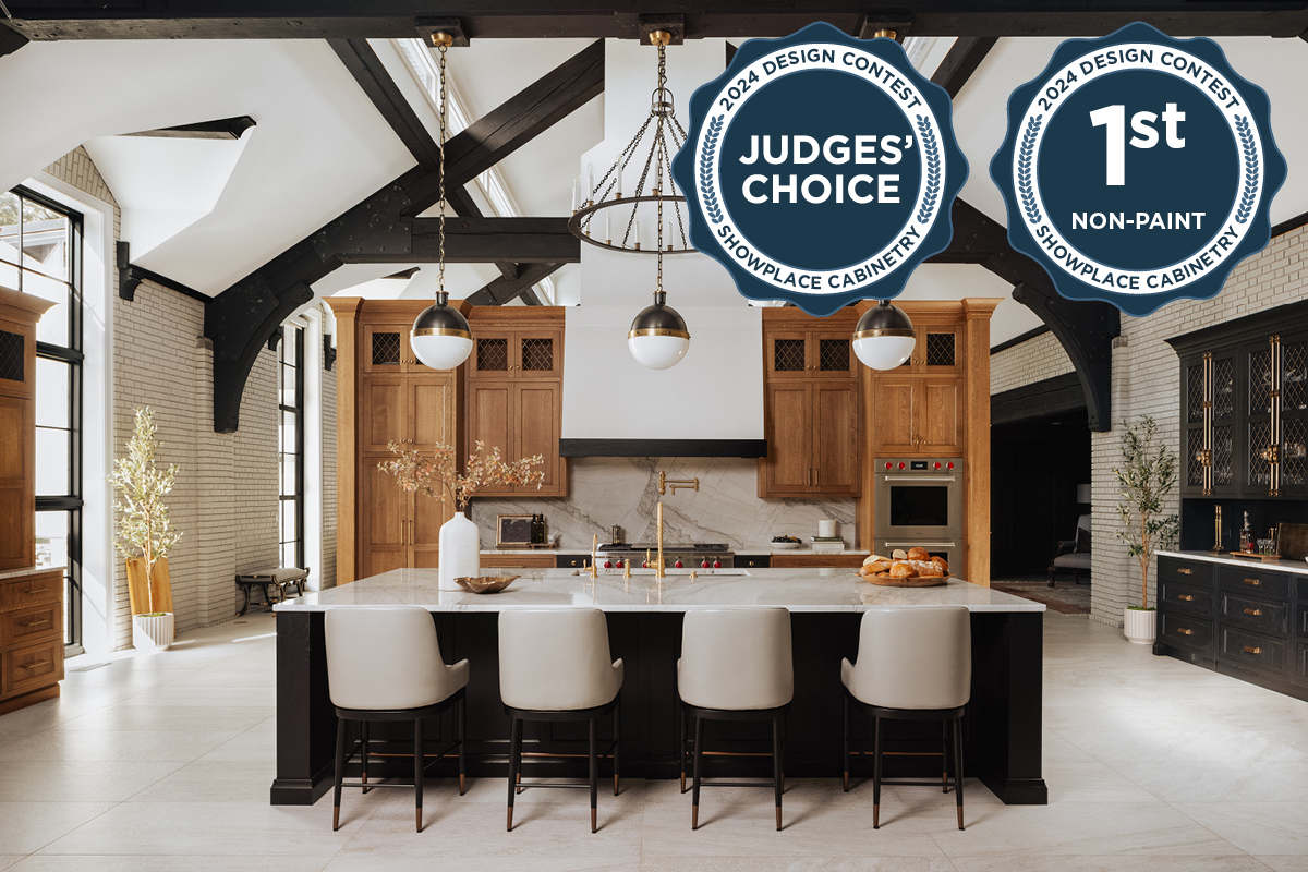 Large open kitchen space with wood beams and stained and painted cabinets