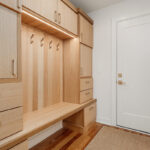 Stained mudroom bench and locker cabinets