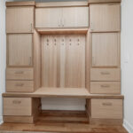 Stained mudroom bench and locker cabinets