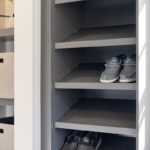 Painted walk-in closet cabinets with shoe storage