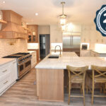 Full kitchen view of a painted perimeter and stained island