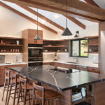 Walnut natural contemporary kitchen with vaulted ceiling and wood beams