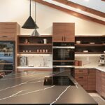 Walnut natural contemporary kitchen with vaulted ceiling and wood beams