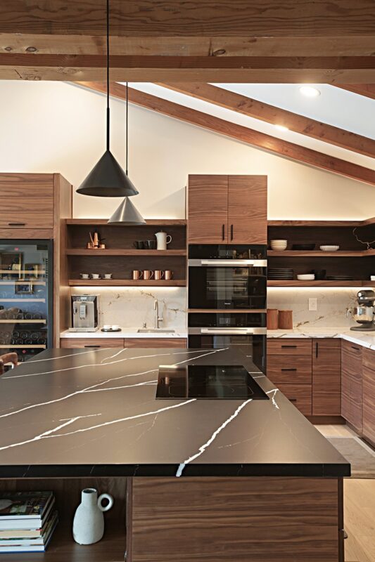 Walnut natural contemporary kitchen with vaulted ceiling and wood beams