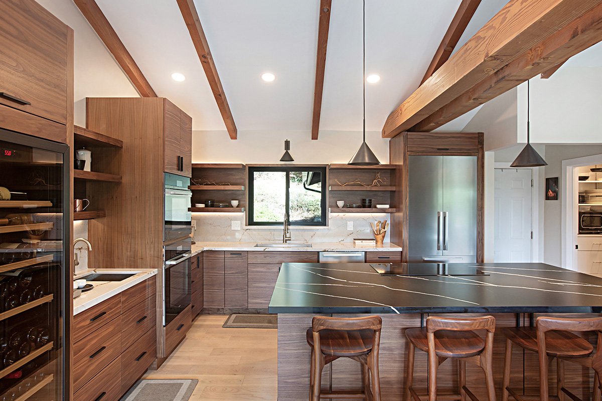 Walnut natural contemporary kitchen with vaulted ceiling and wood beams