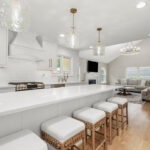 White painted kitchen with island seating