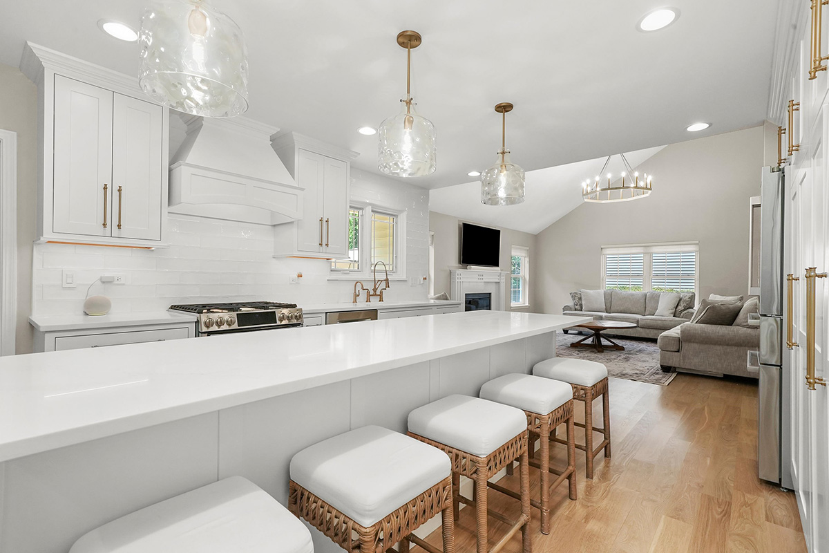 White painted kitchen with island seating