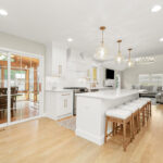 White painted kitchen with island seating