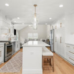 White painted kitchen with island seating