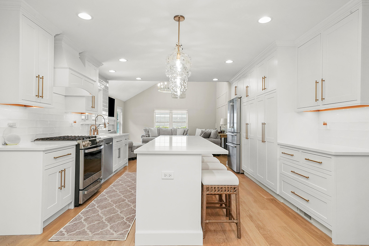 White painted kitchen with island seating