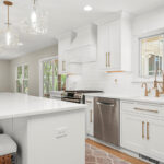 White painted kitchen with island seating