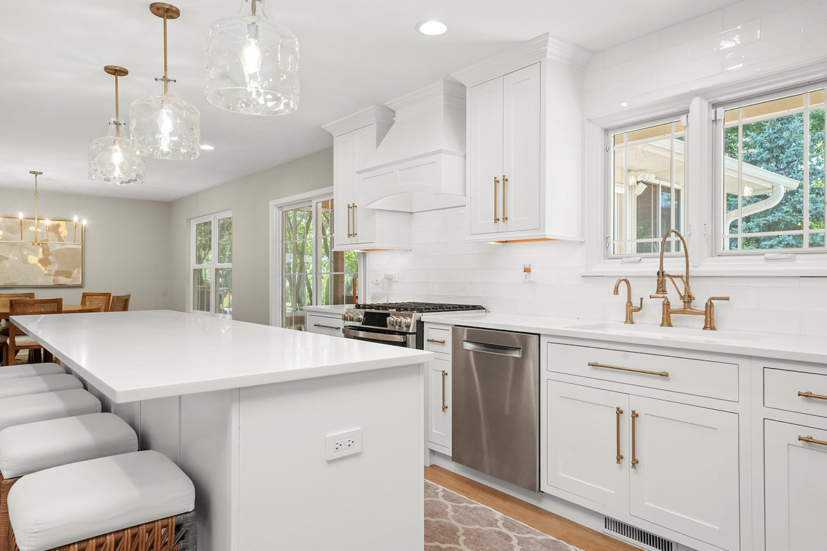 White painted kitchen with island seating