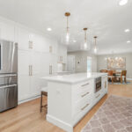 White painted kitchen with island seating