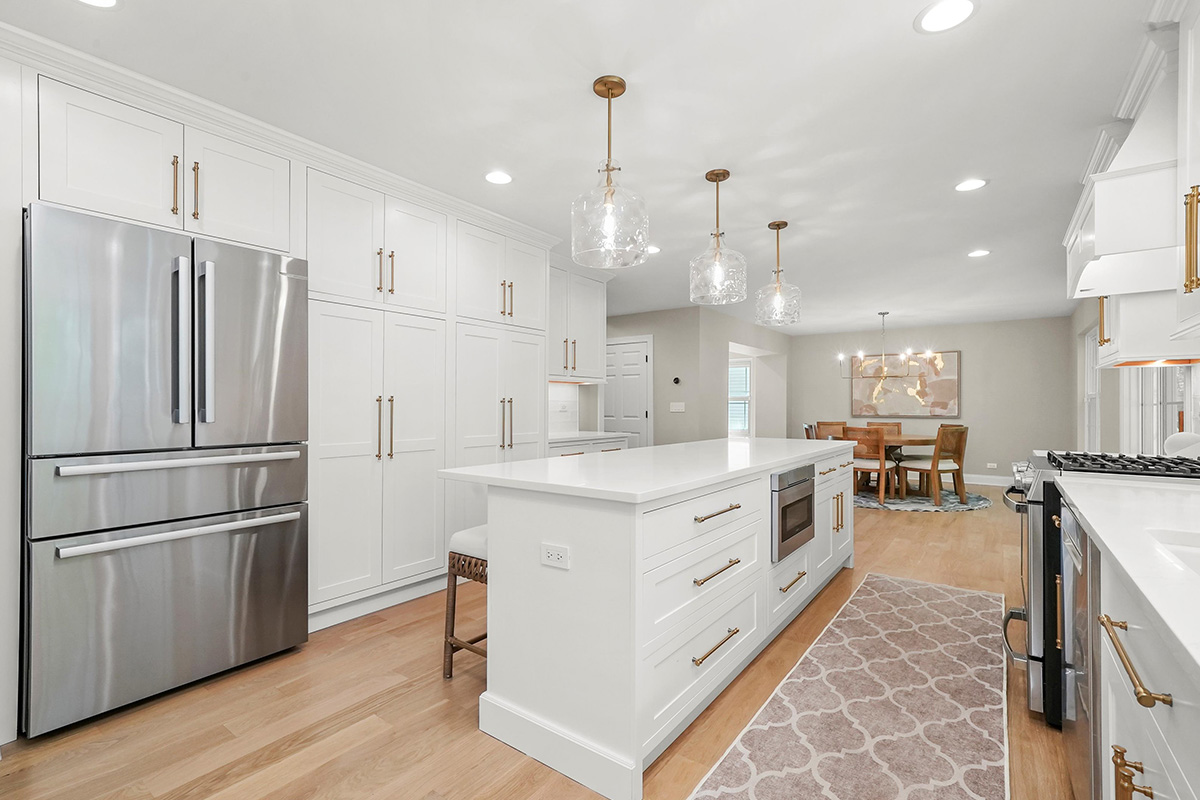 White painted kitchen with island seating