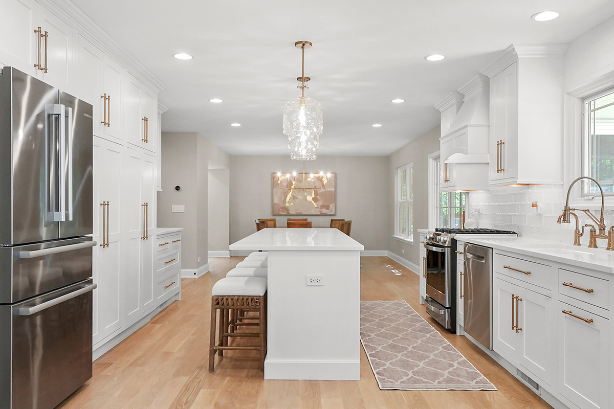 White painted kitchen with island seating