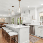 White painted kitchen with island seating