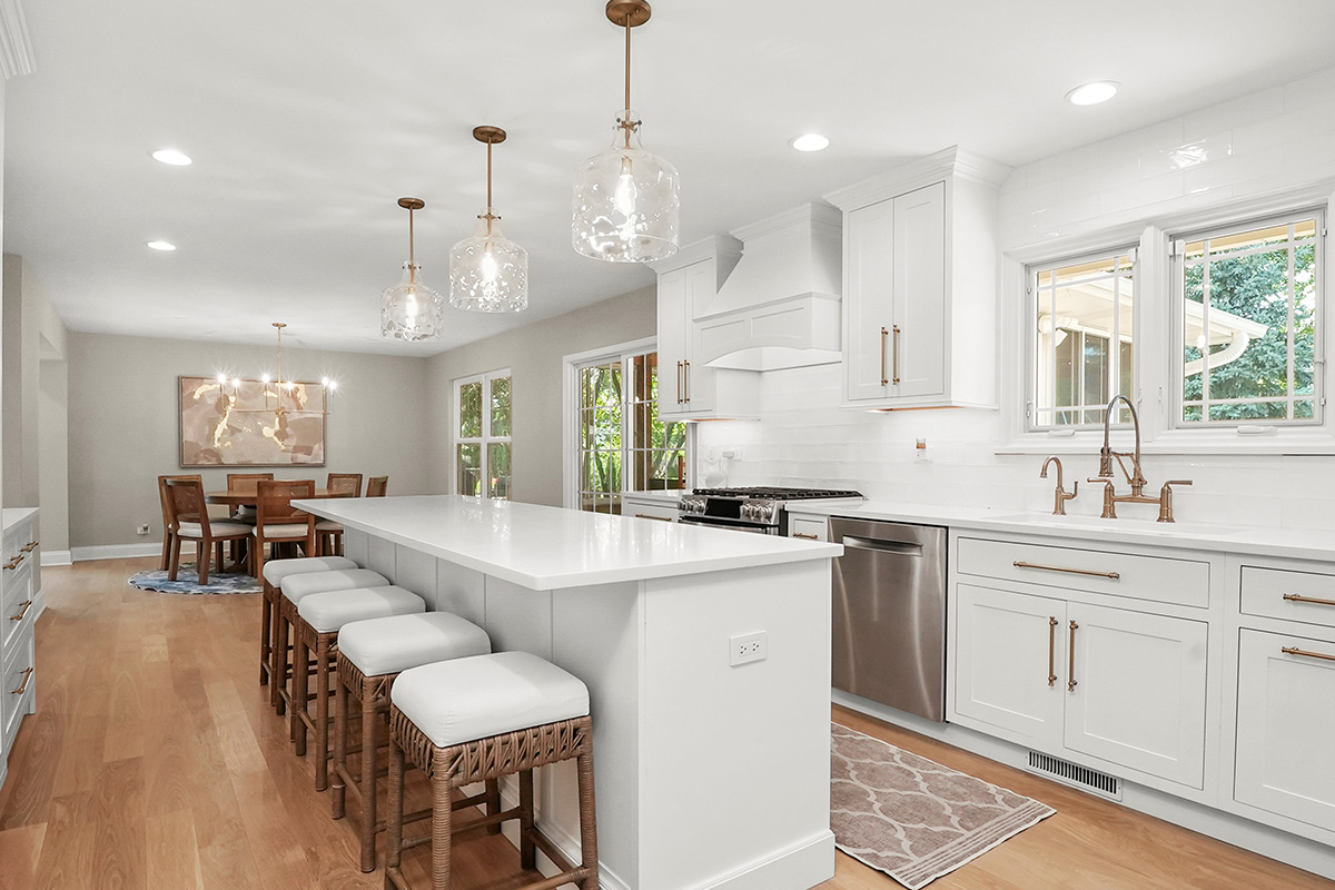 White painted kitchen with island seating