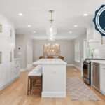 White painted kitchen with island seating