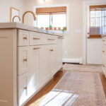 Soft cream painted kitchen cabinets