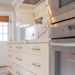 Soft cream painted kitchen cabinets