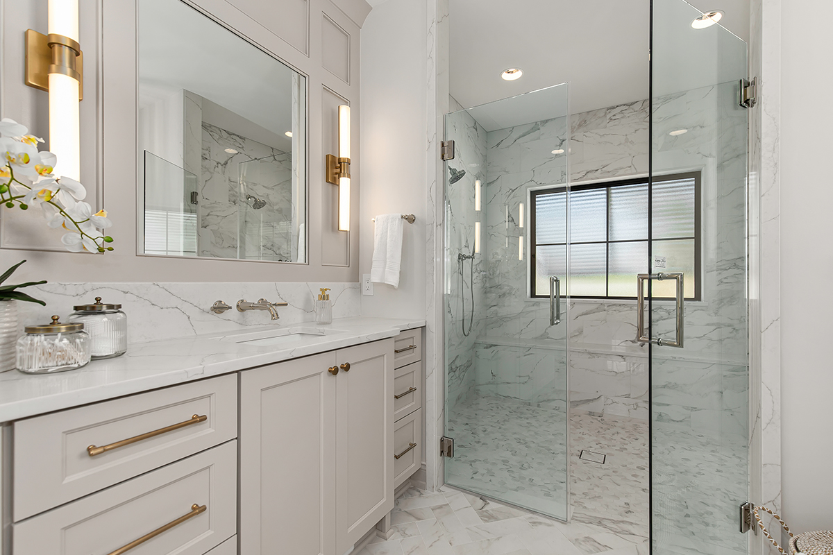 Painted bathroom vanity and shower with clear glass walls