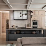 Stained kitchen and white hood with a glass casing over cooktop