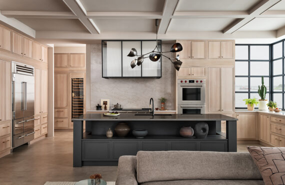 Stained kitchen and white hood with a glass casing over cooktop