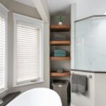 linen closet with stained shelves holding towels