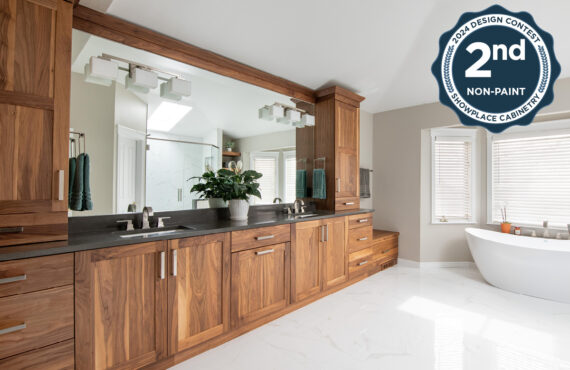 Walnut bathroom cabinets with 2 sinks and countertop storage on each end.