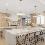 Kitchen and double islands with stained and painted cabinets