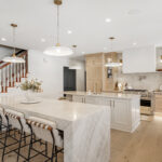 Kitchen and double islands with stained and painted cabinets